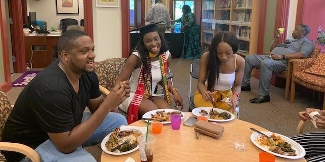 reception for two students sitting with guests